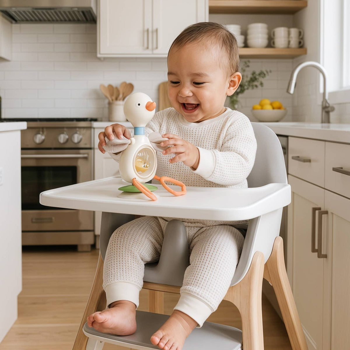 Itzy Twist & Bop™ - High Chair Sensory Toy Goose Duck